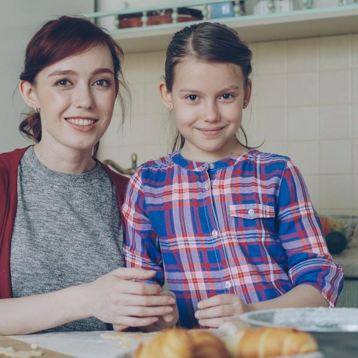 Ava Malik, Lead Design Curator at HarborFieldMeander, reviewing corporate floral arrangements